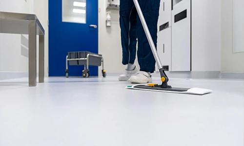Person providing floor cleaning in El Paso, Texas.
